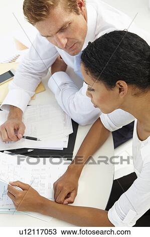 Business meeting in an office View Large Photo Image Stock Image - Business meeting in an office. Fotosearch