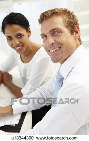 Business meeting in an office View Large Photo Image Stock Image - Business meeting in an office. Fotosearch