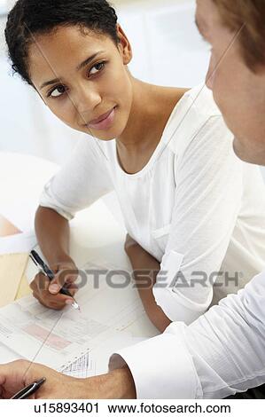Business meeting in an office View Large Photo Image Stock Image - Business meeting in an office. Fotosearch