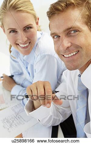 Stock Photograph - Business meeting in an office. Fotosearch