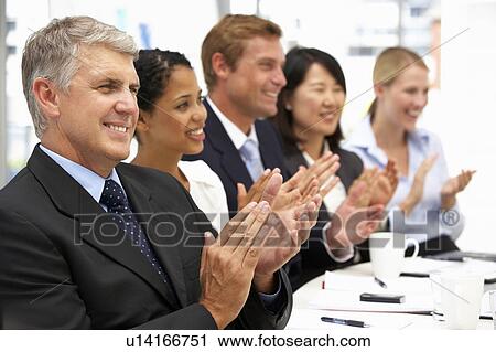 Stock Image - Business people clapping. Fotosearch