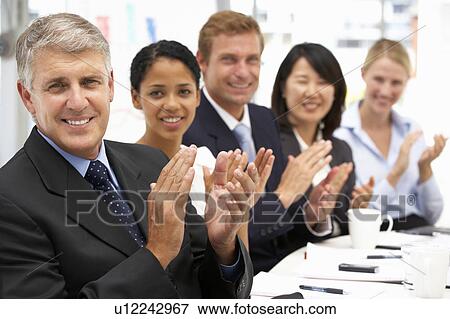 Stock Photo - Business people clapping. Fotosearch