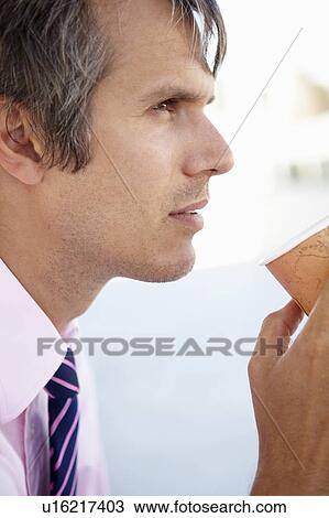Businessman drinking coffee View Large Photo Image Stock Image - Businessman drinking coffee. Fotosearch