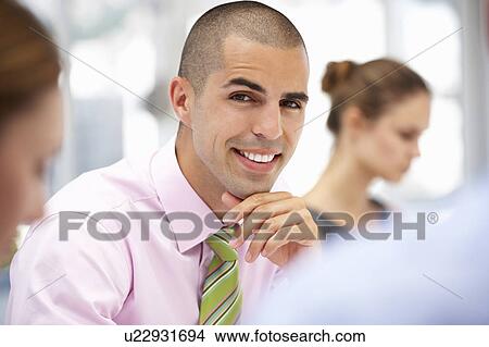 Picture - Businessman in meeting. Fotosearch