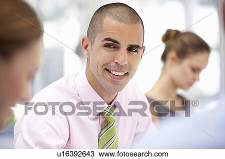 Stock Image - Businessman in meeting. Fotosearch