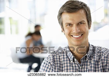 Stock Image - Businessman in office. Fotosearch