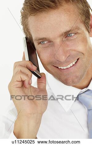 Stock Photography - Businessman talking on phone. Fotosearch