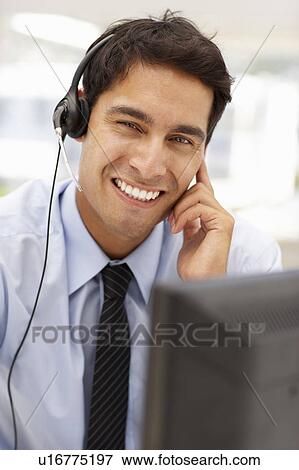 Businessman wearing headset View Large Photo Image Stock Photo - Businessman wearing headset. Fotosearch