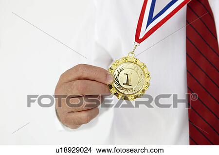 Businessman wearing medal View Large Photo Image Picture - Businessman wearing medal. Fotosearch