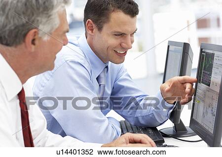 Businessmen working on computers View Large Photo Image Stock Image - Businessmen working on computers. Fotosearch