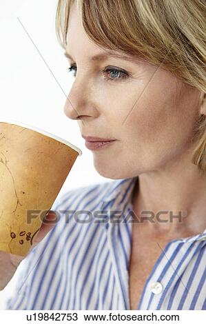 Businesswoman drinking takeout coffee View Large Photo Image Stock Image - Businesswoman drinking takeout coffee. Fotosearch