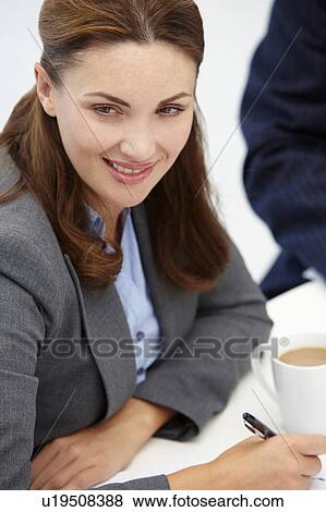 Businesswoman in meeting View Large Photo Image Stock Photo - Businesswoman in meeting. Fotosearch