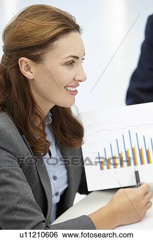 Stock Photograph - Businesswoman in meeting. Fotosearch