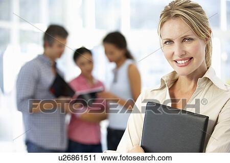 Stock Image - Businesswoman in office. Fotosearch