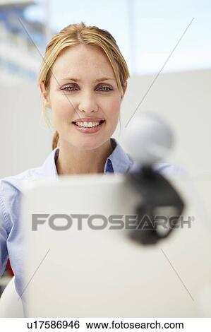 Businesswoman using skype View Large Photo Image Stock Photograph - Businesswoman using skype. Fotosearch