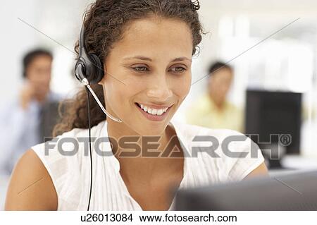 Businesswoman wearing headset View Large Photo Image Picture - Businesswoman wearing headset. Fotosearch