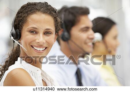 Businesswoman wearing headset View Large Photo Image Stock Image - Businesswoman wearing headset. Fotosearch
