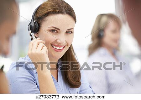 Businesswoman wearing headset View Large Photo Image Stock Image - Businesswoman wearing headset. Fotosearch