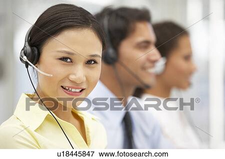 Businesswoman wearing headset View Large Photo Image Stock Photo - Businesswoman wearing headset. Fotosearch