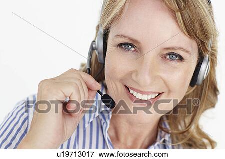 Stock Photo - Businesswoman wearing headset. Fotosearch