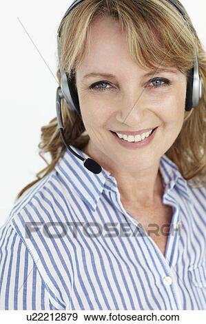 Businesswoman wearing headset View Large Photo Image Stock Photo - Businesswoman wearing headset. Fotosearch