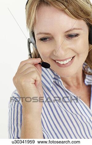 Businesswoman wearing headset View Large Photo Image Stock Photo - Businesswoman wearing headset. Fotosearch