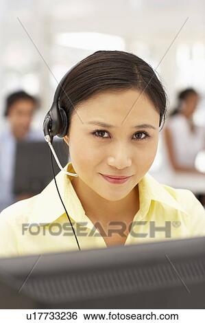 Businesswoman wearing headset View Large Photo Image Stock Photograph - Businesswoman wearing headset. Fotosearch