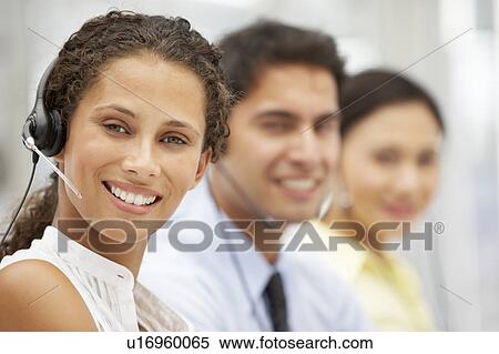 Stock Photography - Businesswoman wearing headset. Fotosearch
