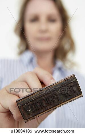 Businesswoman with rubber stamp View Large Photo Image Stock Photography - Businesswoman with rubber stamp. Fotosearch