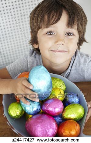Child with Easter eggs View Large Photo Image Stock Photo - Child with Easter eggs. Fotosearch
