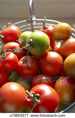 Stock Photo - Close up fresh tomatoes. Fotosearch