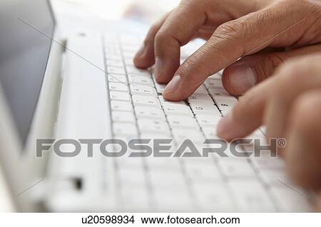 Close up man using computer keyboard View Large Photo Image Picture - Close up man using computer keyboard. Fotosearch