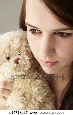 Close up teenage girl with cuddly toy View Large Photo Image Stock Photo - Close up teenage girl with cuddly toy. Fotosearch