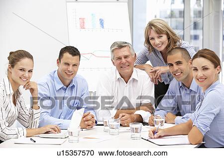 Stock Image - Colleagues in business meeting. Fotosearch