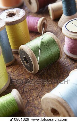 Cotton reels on table top View Large Photo Image Stock Photo - Cotton reels on table top. Fotosearch
