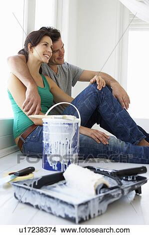 Couple decorating house View Large Photo Image Picture - Couple decorating house. Fotosearch