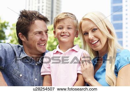 Stock Photo - Couple in city park with young son. Fotosearch
