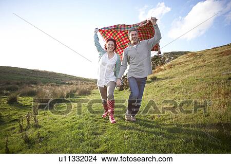 Picture - Couple in countryside. Fotosearch
