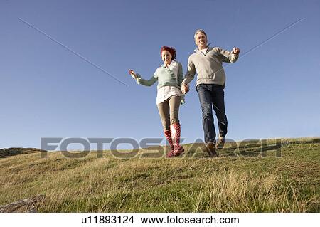 Couple in countryside View Large Photo Image Picture - Couple in countryside. Fotosearch