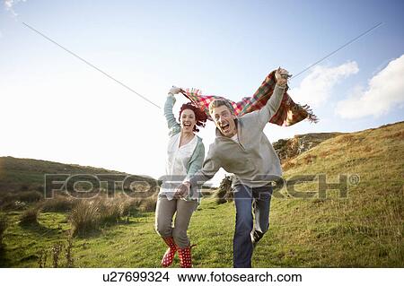 Picture - Couple in countryside. Fotosearch