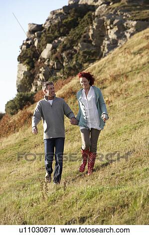 Stock Image - Couple in countryside. Fotosearch