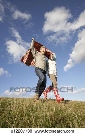 Couple in countryside View Large Photo Image Stock Photo - Couple in countryside. Fotosearch