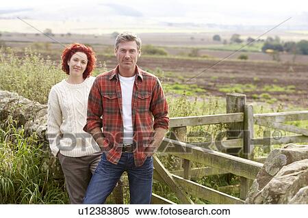 Couple in countryside View Large Photo Image Stock Photography - Couple in countryside. Fotosearch