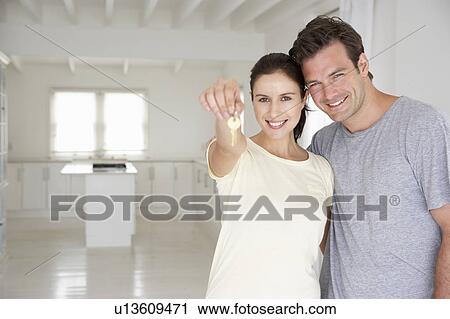 Stock Image - Couple in new home. Fotosearch