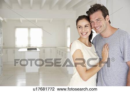 Stock Image - Couple in new home. Fotosearch
