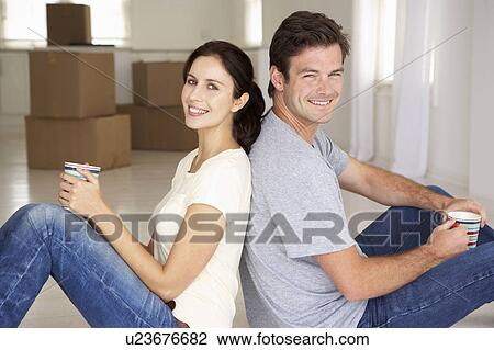 Stock Image - Couple in new home. Fotosearch