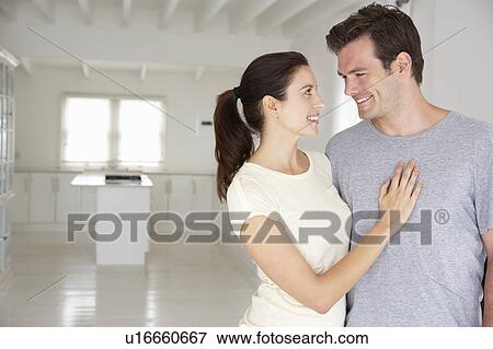 Stock Photo - Couple in new home. Fotosearch