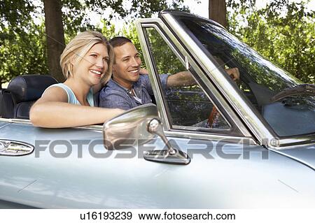 Couple in sports car View Large Photo Image Stock Photo - Couple in sports car. Fotosearch