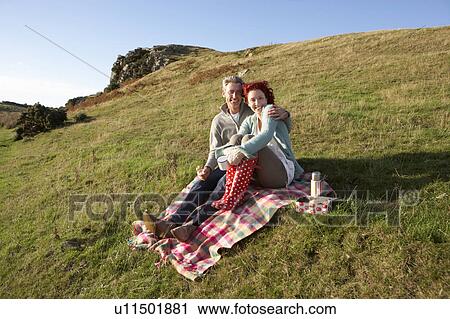 Stock Image - Couple on country picnic. Fotosearch