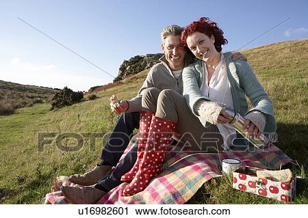 Couple on country picnic View Large Photo Image Stock Image - Couple on country picnic. Fotosearch